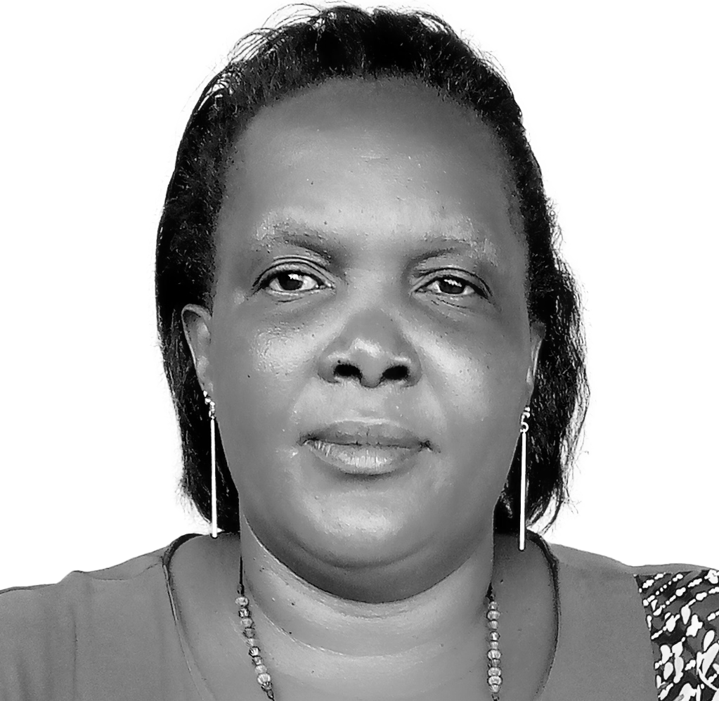 Christine Oliver Dhikusooka smiles into the camera.