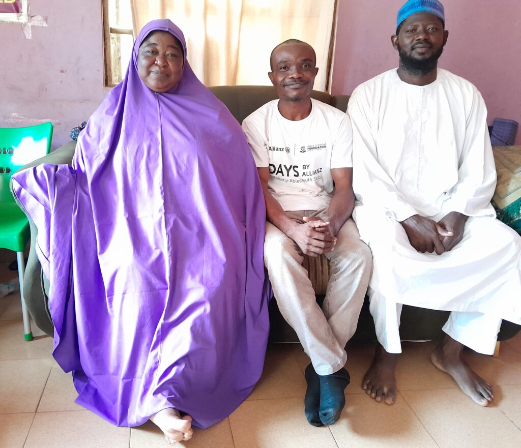 Alexander Ogheneruemu (center) interviews Hajiya Amina Ahmed (left), a Deaf teacher and former National Women Leader of the Nigerian National Association of the Deaf, alongside Bello Mohammed Suleiman (right), chair of the Niger State Association of the Deaf.