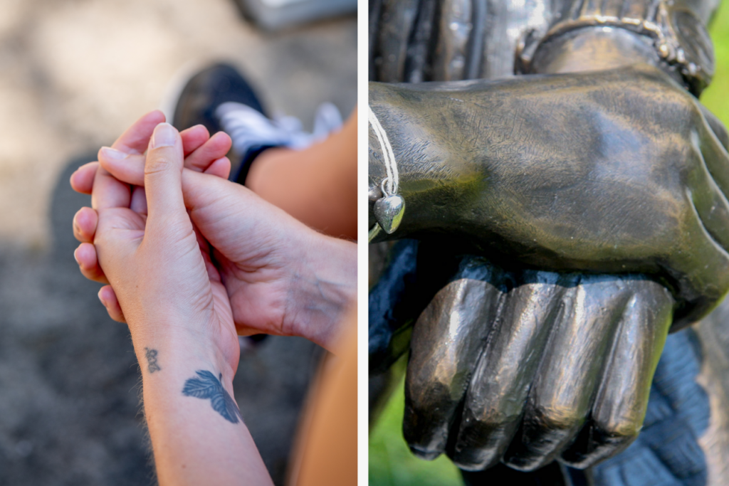 A split screen image. On the left, Marian holds her own hand, with a tattoo of a flower on her wrist. On the right is David's grave - a statue of his hands doing the same.