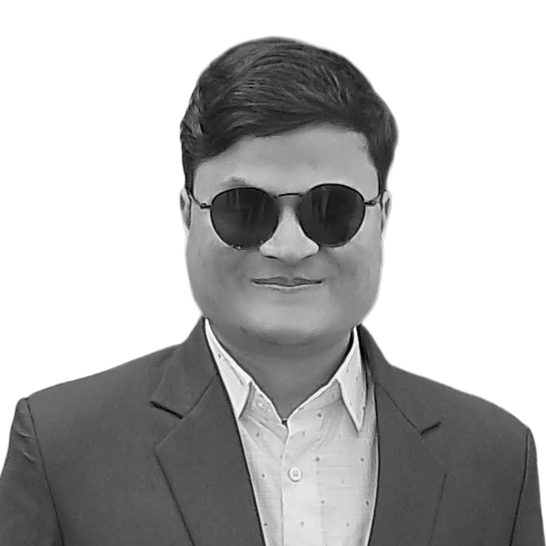 Bam Bahadur B.K. smiles into the camera. He is a young Nepali man with dark glasses and short, black hair.