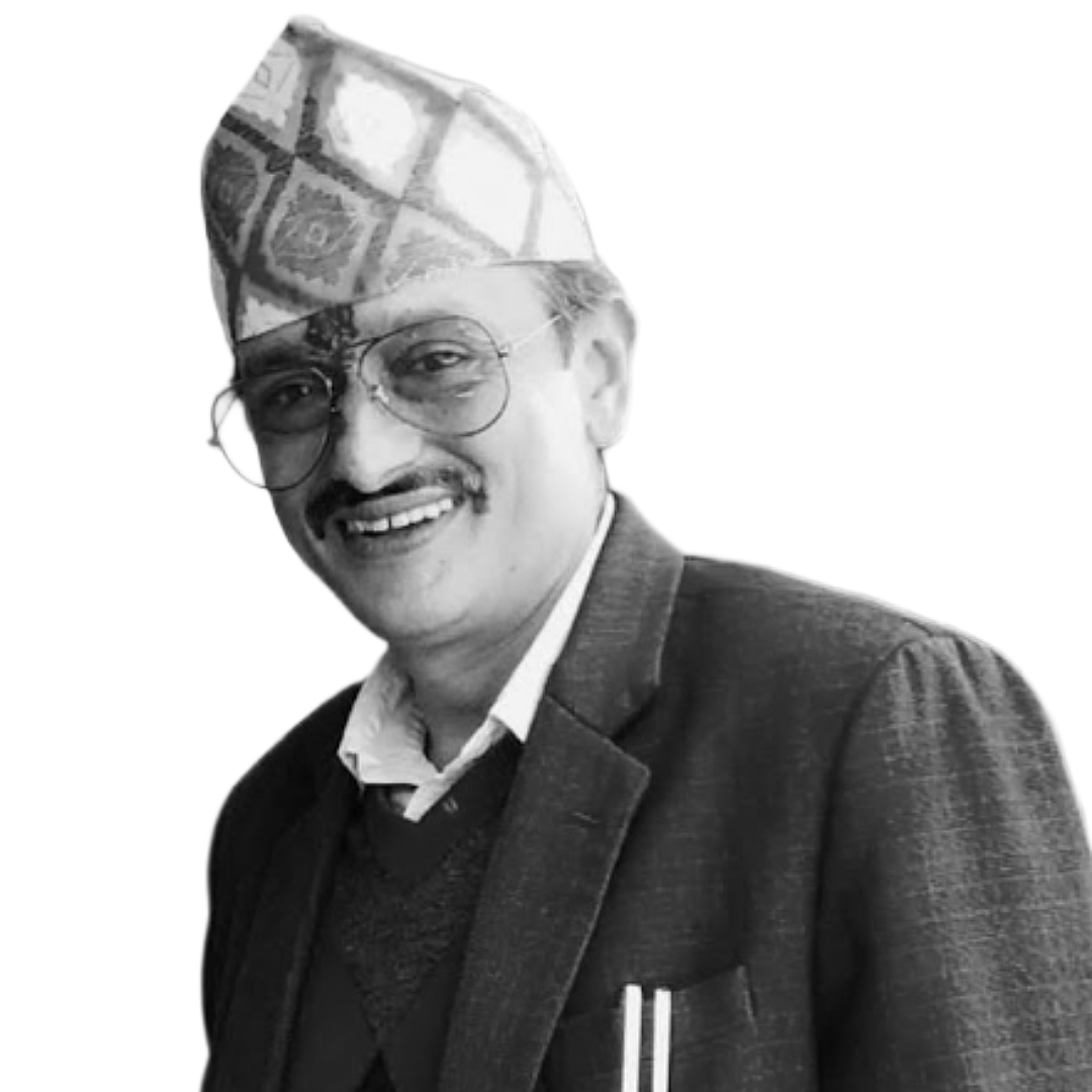 Bishnu Acharya smiles into the camera. He is a middle-aged Nepali man with a mustache, glasses, and a hat over a bindi on his forehead.