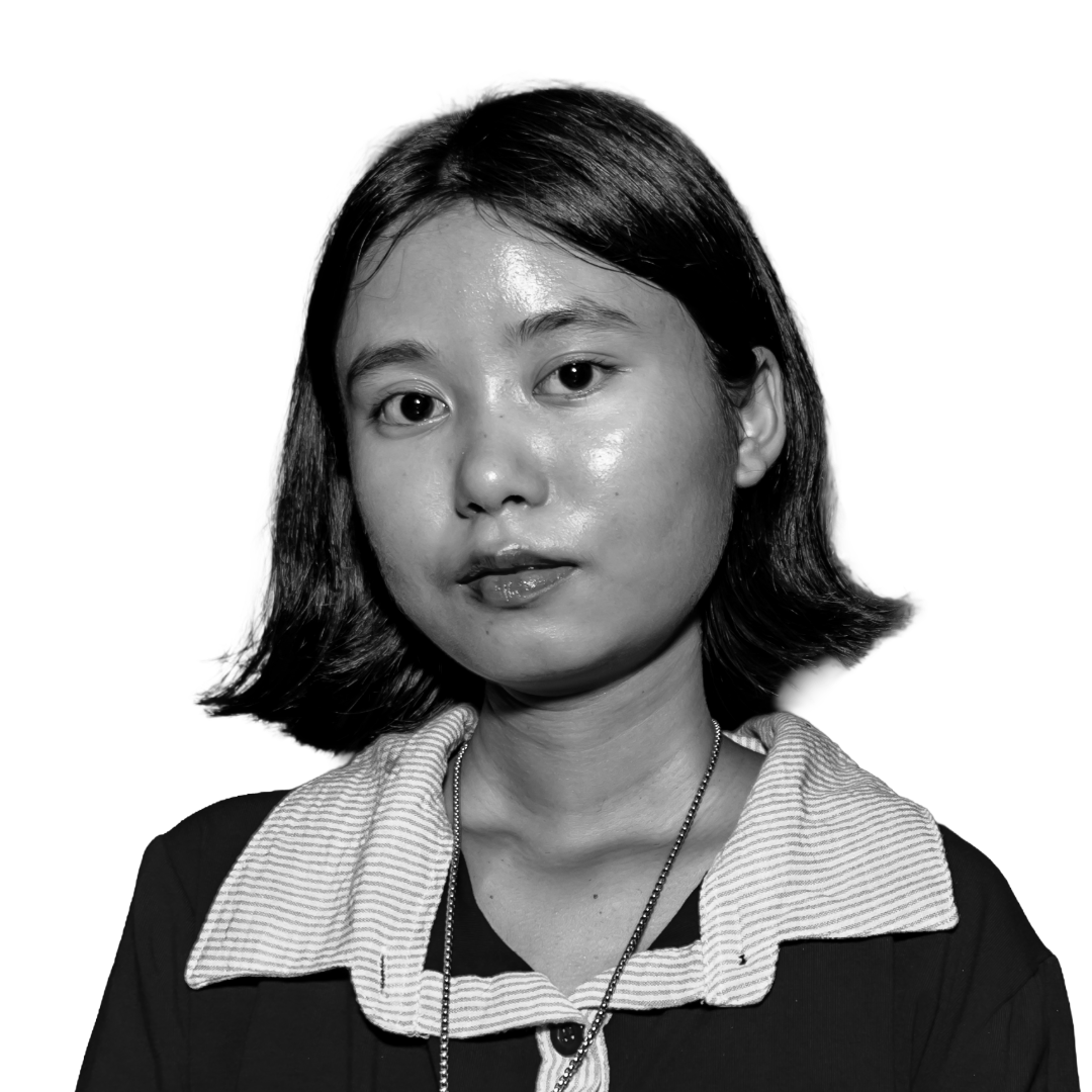 Punam Bhujel looks into the camera with a relaxed expression. She is a young Nepali woman with dewey skin and dark, shoulder-length hair.