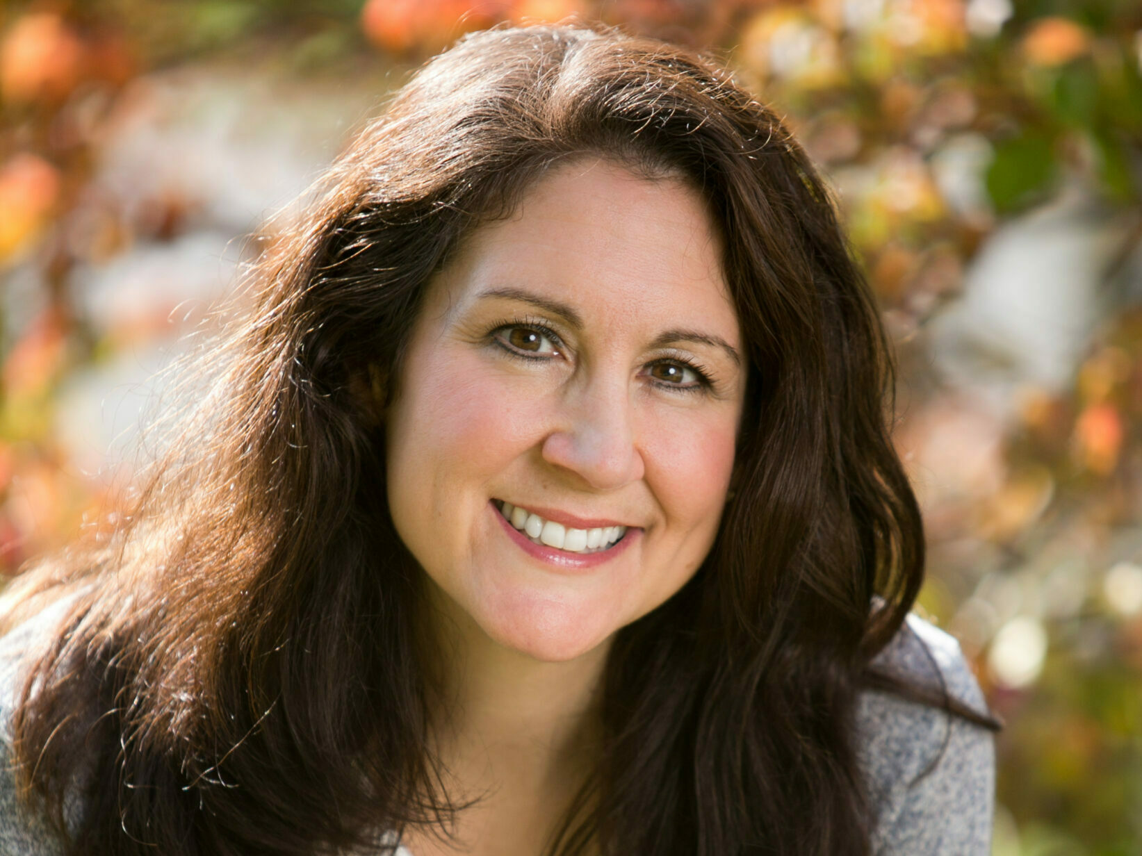 Meredith O'Brien smiles at the camera.