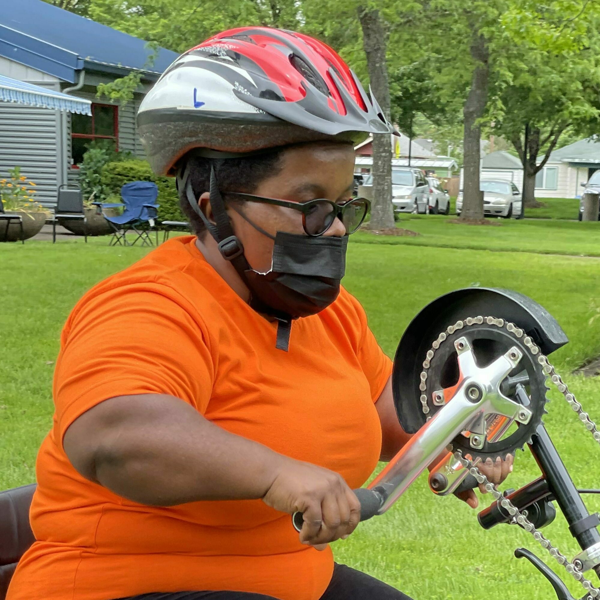 Esther Mukampogazi rides a hand-operated bicycle.