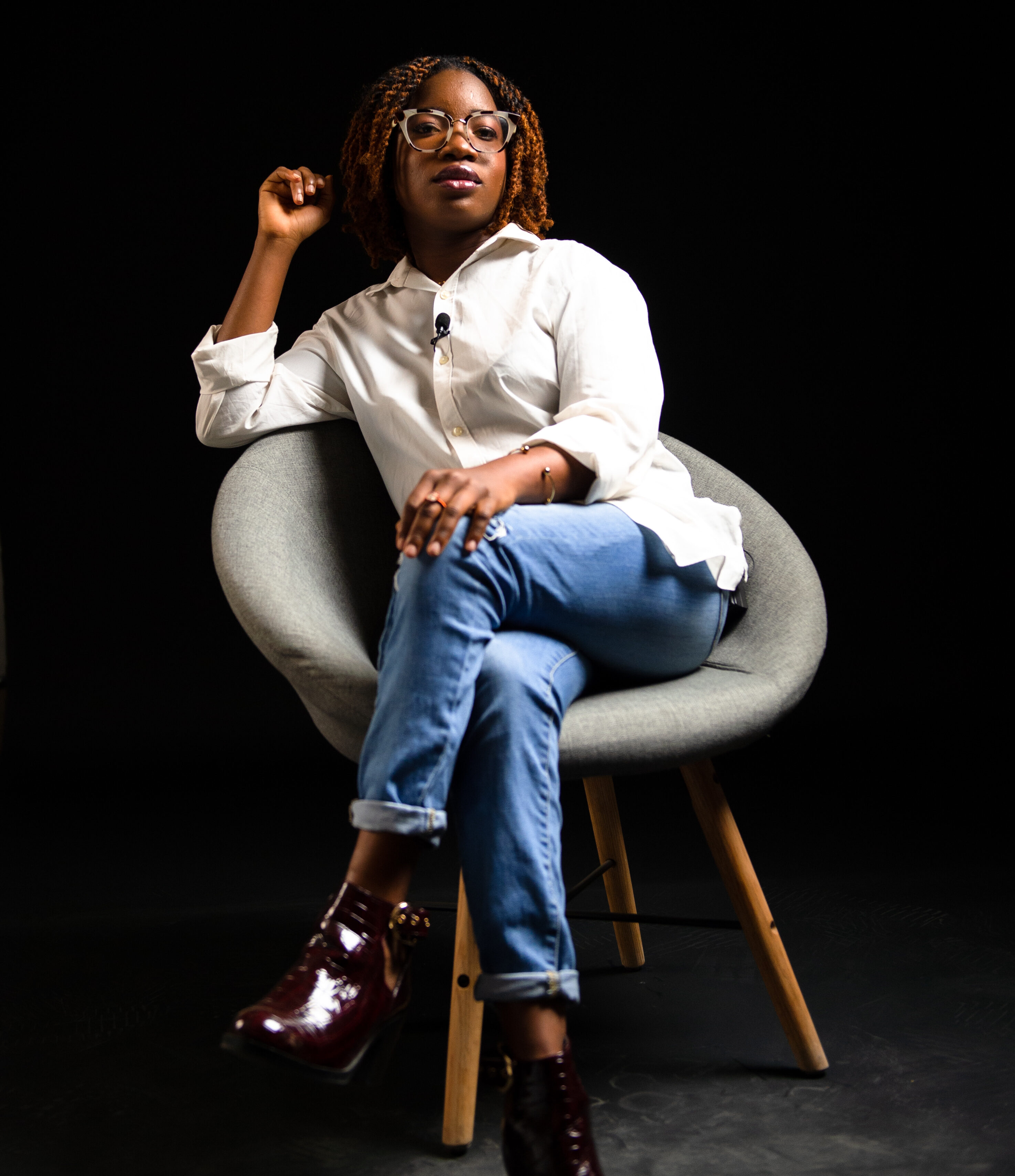 Benedicta Oyedayo Oyewole sits in a chair, looking at the camera.