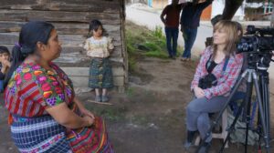 Jody Santos interviews an indigenous woman from Guatemala.