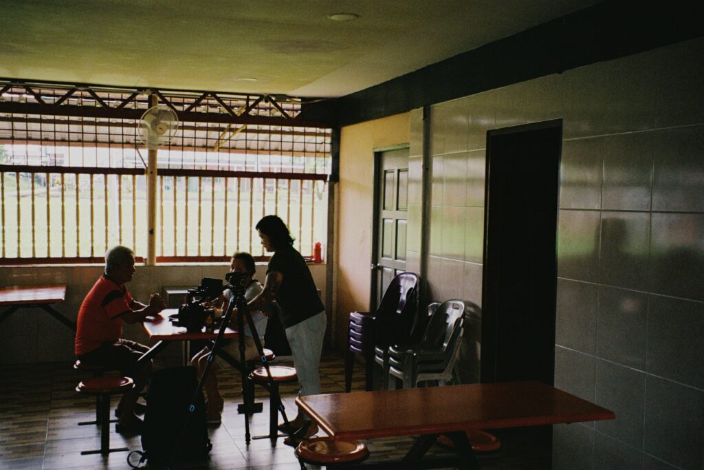 Bea Leong on set. She is filming in a restaurant with her mother and uncle.