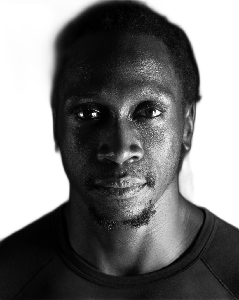 Isaac Oboth looks into the camera.