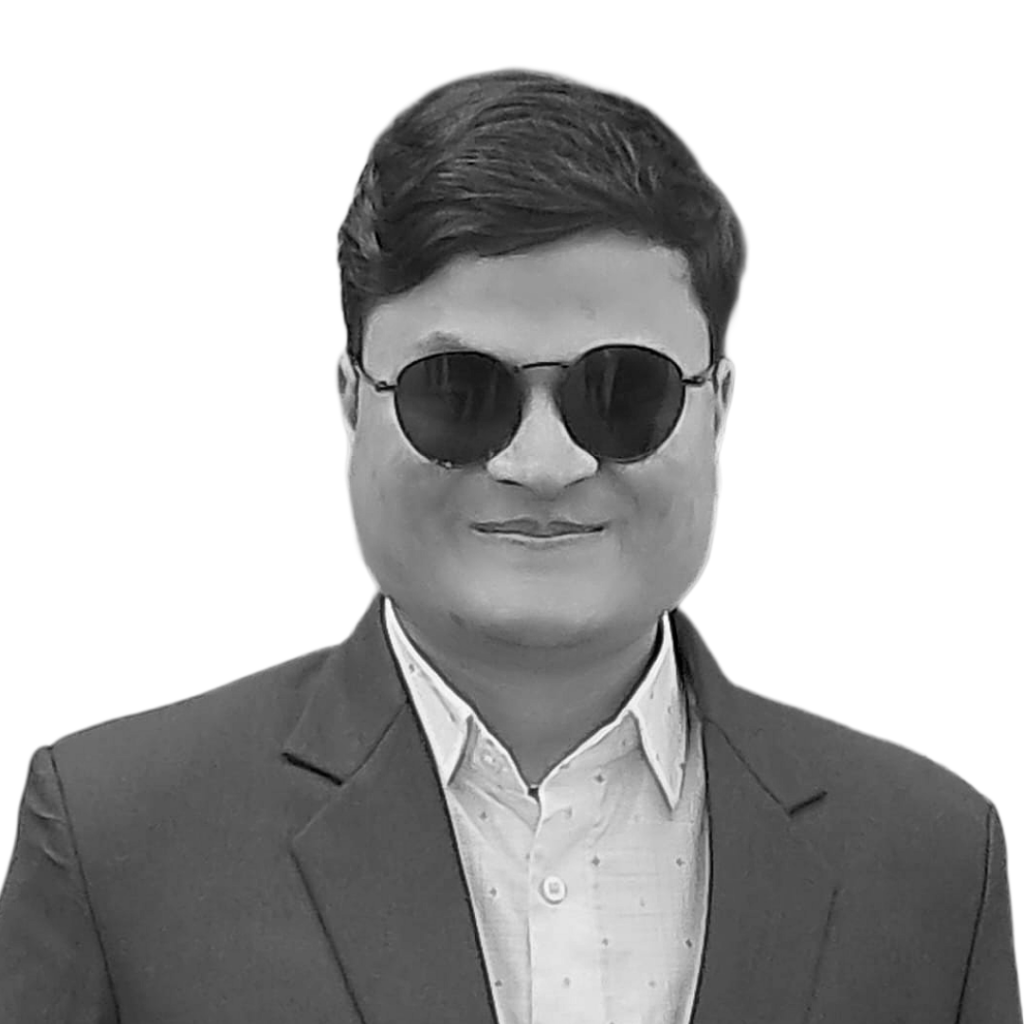 Bam Bahadur B.K. smiles into the camera. He is a young Nepali man with dark glasses and short, black hair.