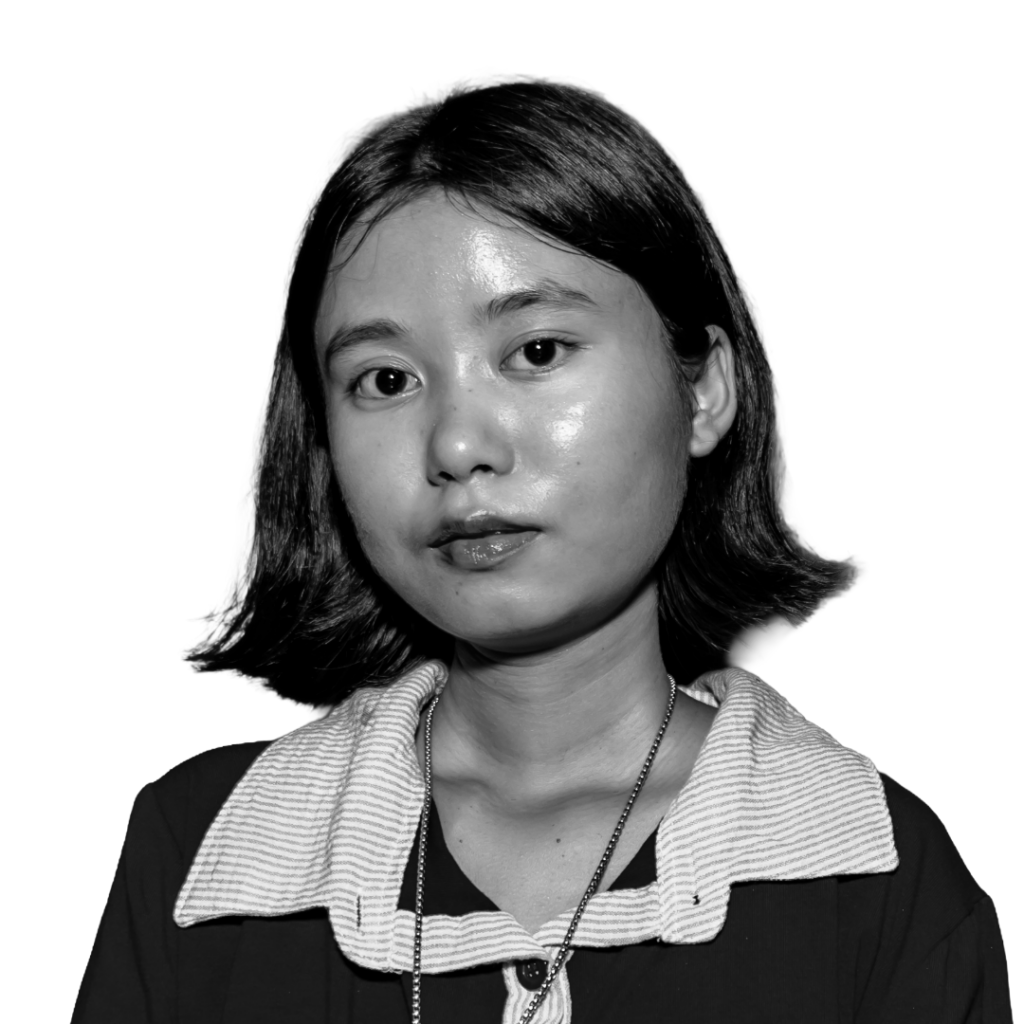 Punam Bhujel looks into the camera with a relaxed expression. She is a young Nepali woman with dewey skin and dark, shoulder-length hair.